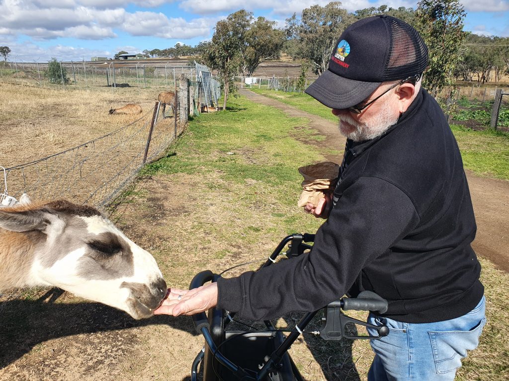 A Sunshine Connect participant enjoying a community farm activity